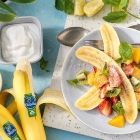 Tropical organic Chiquita banana split with coconut and mint